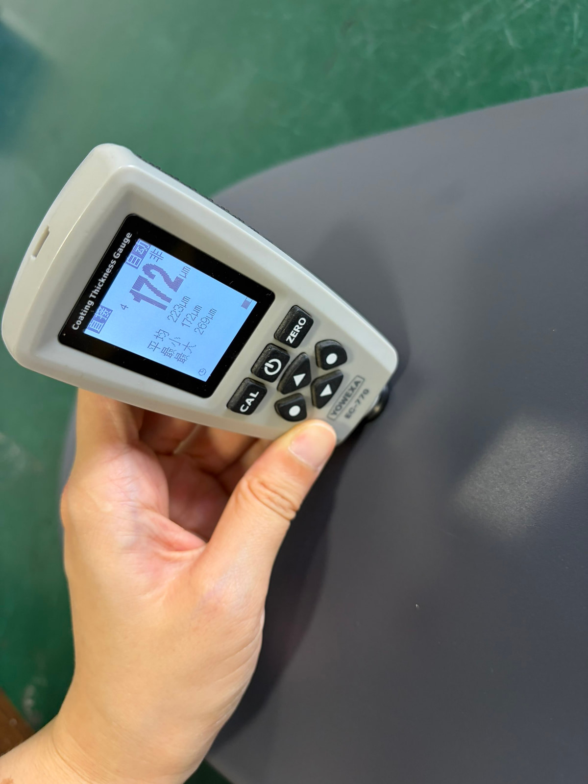 LUXIFIC Square II street luminaire coating thickness inspection using a YOWEXA EC-770 gauge showing a current reading of 172um