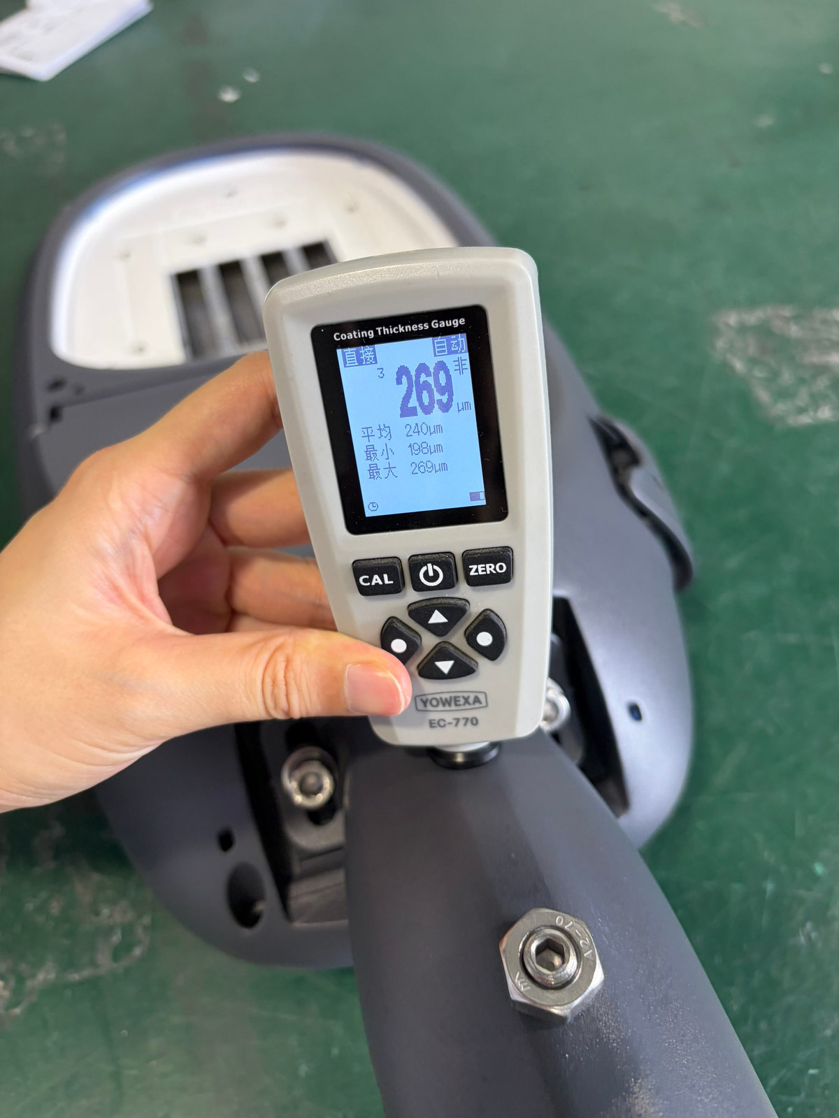 LUXIFIC Square II street luminaire coating thickness inspection using a YOWEXA EC-770 gauge showing a current reading of 269um